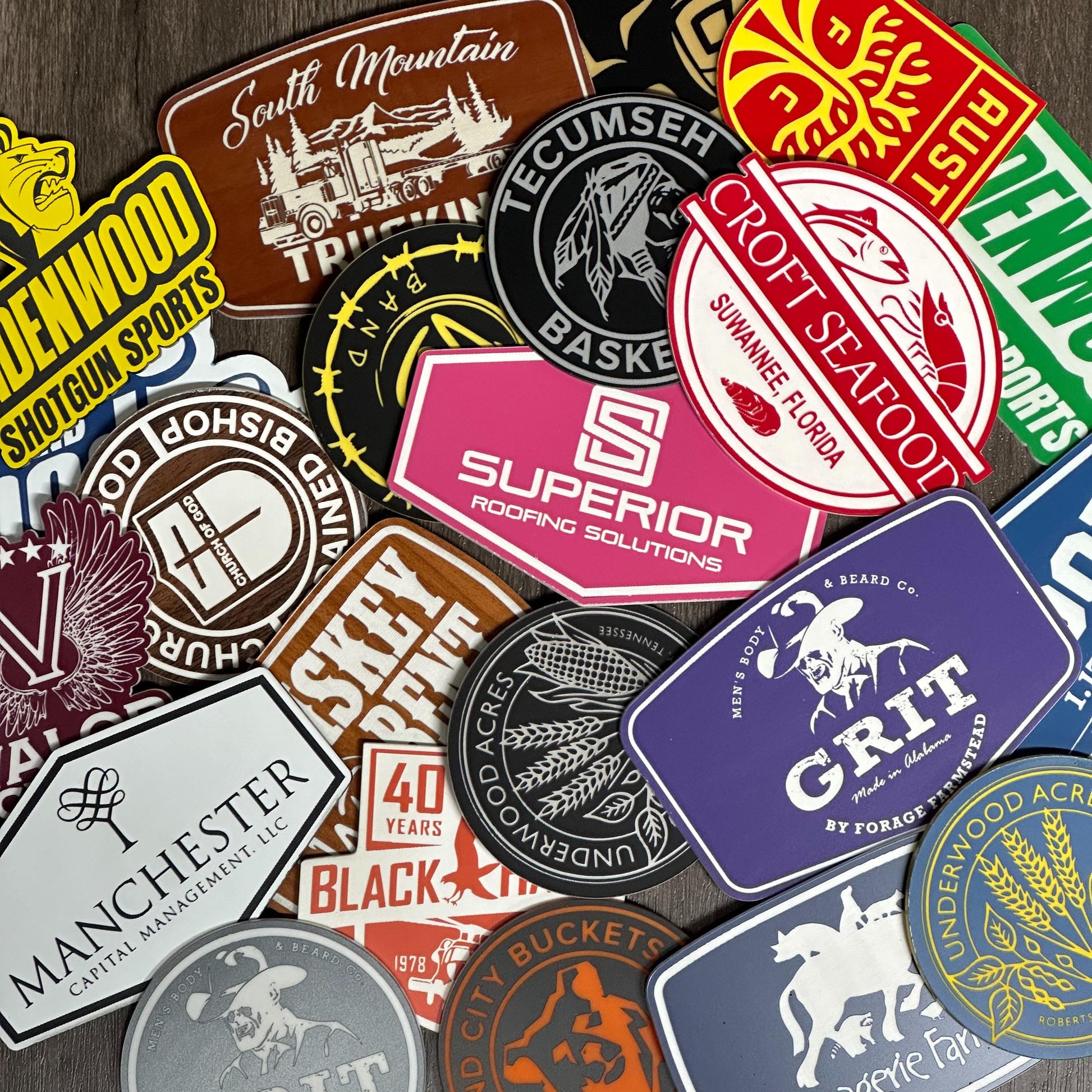 a bunch of different colored stickers on a table