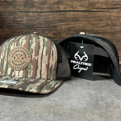 a pair of camouflage-patterned baseball caps, one with a label and the other without.