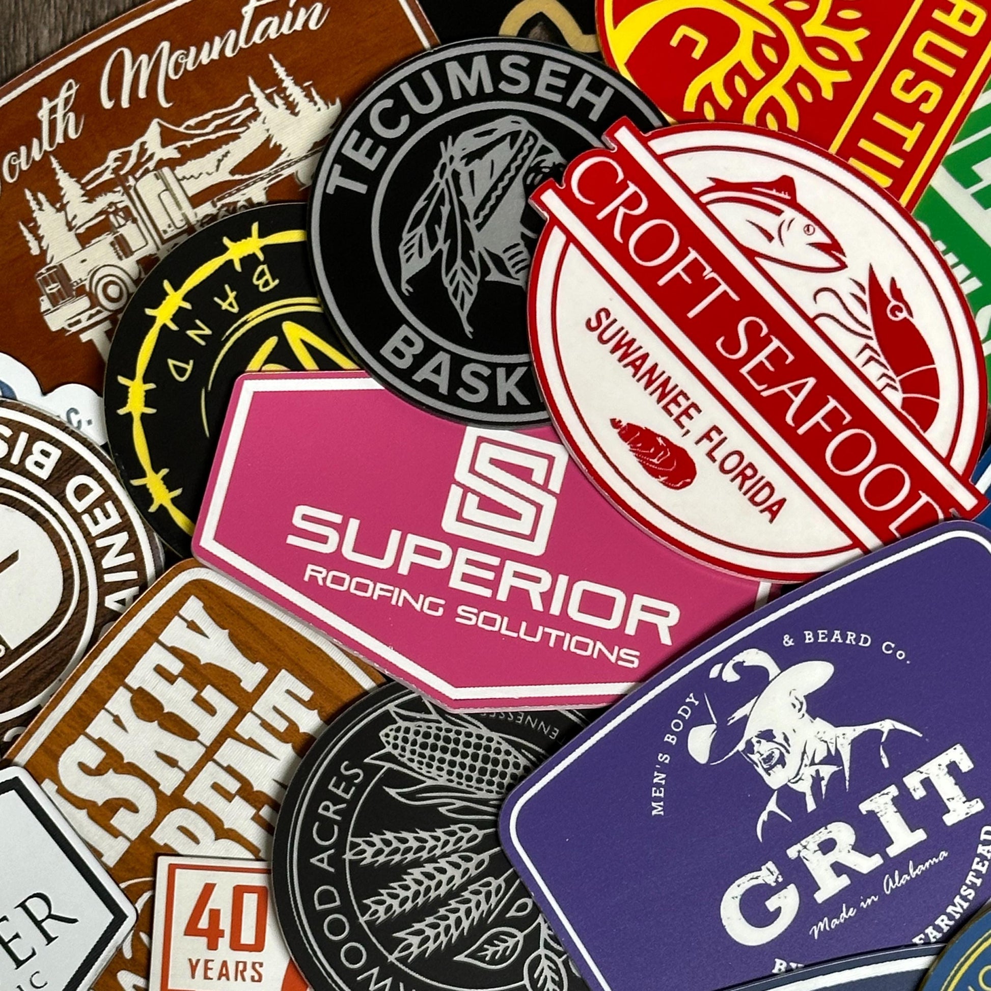 a pile of different colored and black and white stickers